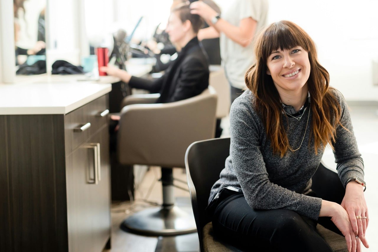 Ethnic small business owner smiling cheerfully in her shop Franchise Your Business